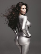 Reality tv star Kim Kardashian posing naked covered in silver paint
