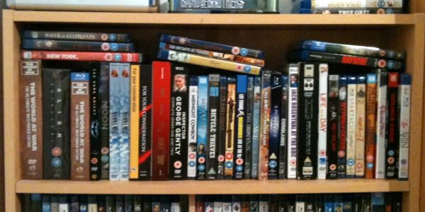 A shelf full of DVD's.