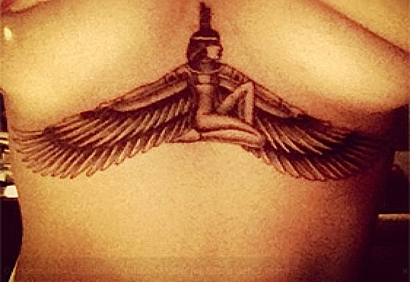 Rihanna's boobs. Ruined by a tattoo.