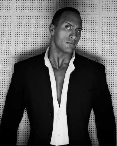 The Rock wearing a suit.