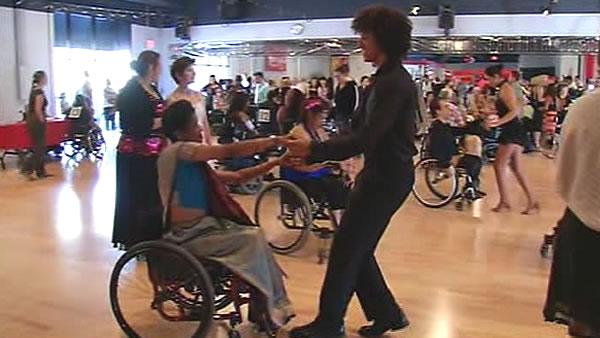 People in wheelchairs dancing.