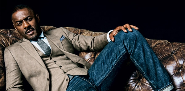 idris elba looks smoking hot on a couch