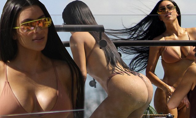 Kim and khloe kardashian relax poolside on their costa rican vacation.